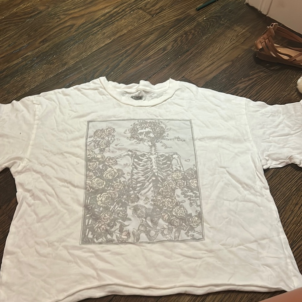 White Cropped American eagle graphic tee with skeleton graphics on it.